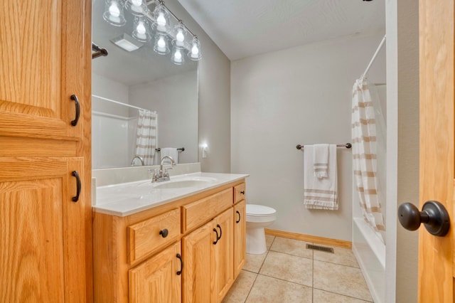 full bathroom with tile patterned floors, shower / bath combo with shower curtain, vanity, and toilet