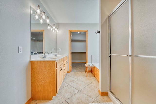 bathroom featuring tile patterned flooring, vanity, and independent shower and bath