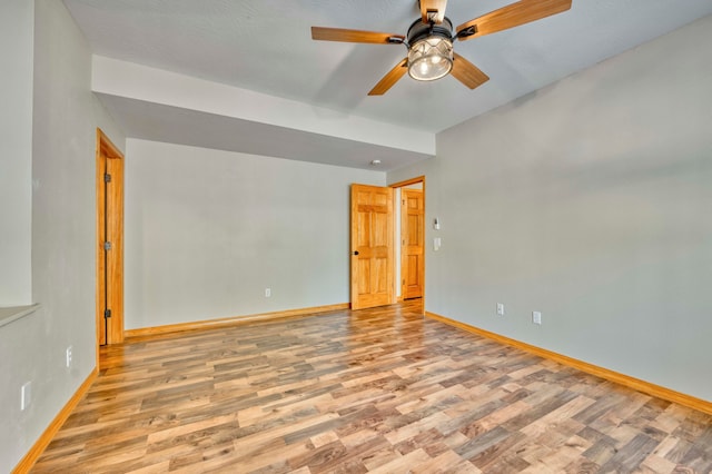 unfurnished room featuring ceiling fan and light hardwood / wood-style flooring