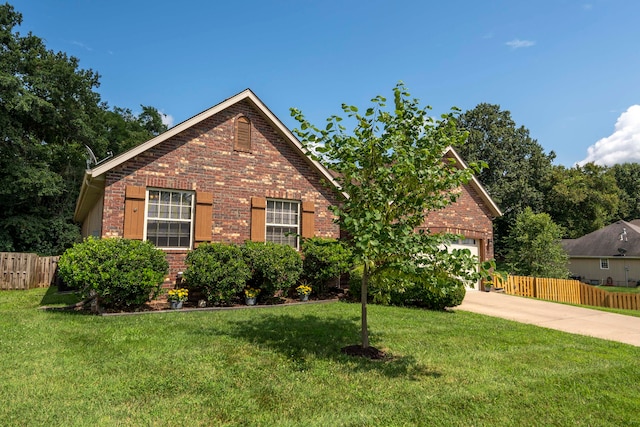 view of property featuring a front yard and a garage