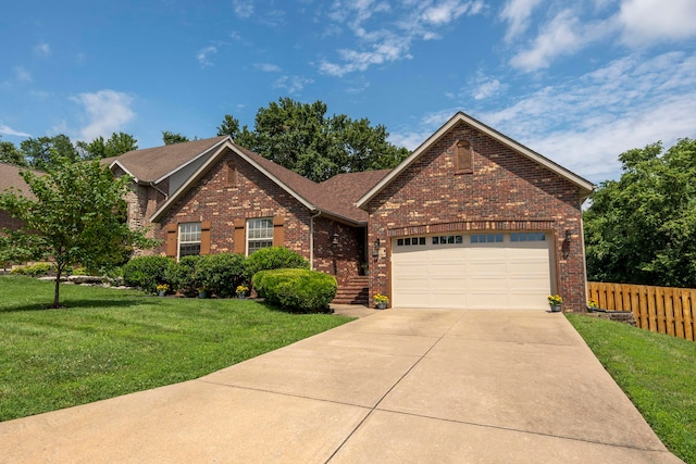 view of property with a front yard and a garage