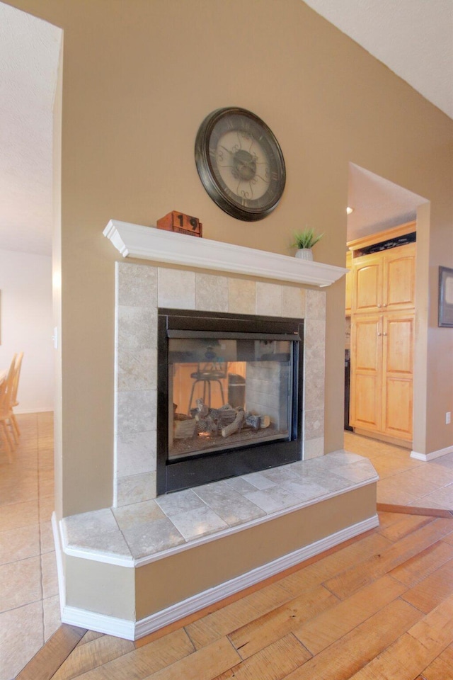 room details with hardwood / wood-style flooring and a fireplace