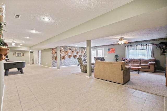 carpeted living room featuring a textured ceiling