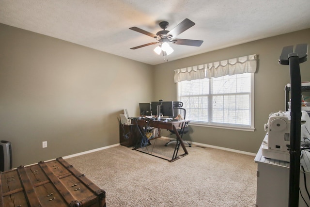 carpeted office with ceiling fan