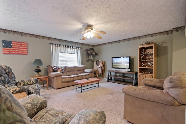 carpeted living room with ceiling fan and a textured ceiling