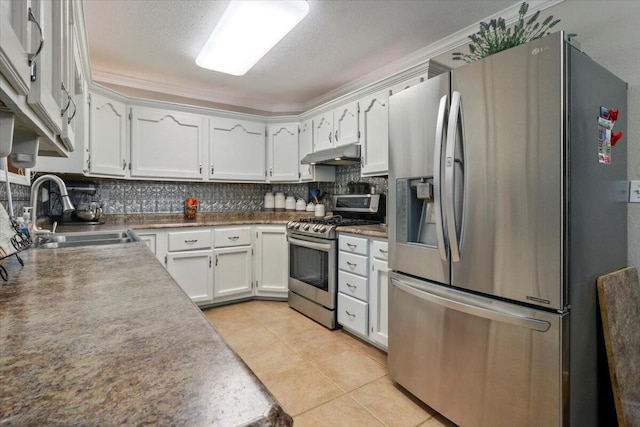 kitchen with white cabinets, sink, light tile patterned floors, tasteful backsplash, and stainless steel appliances