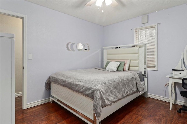 bedroom with dark hardwood / wood-style floors and ceiling fan