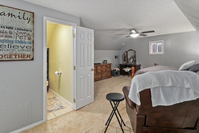 carpeted bedroom featuring ceiling fan and vaulted ceiling