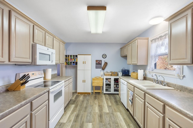 kitchen with light hardwood / wood-style floors, white appliances, sink, and light brown cabinetry