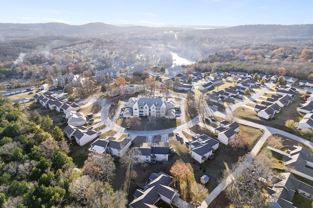 474 Woodland Dr E, Branson, MO 65616 - aerial view of property and surrounding area featuring nearby suburban area and a mountainous background