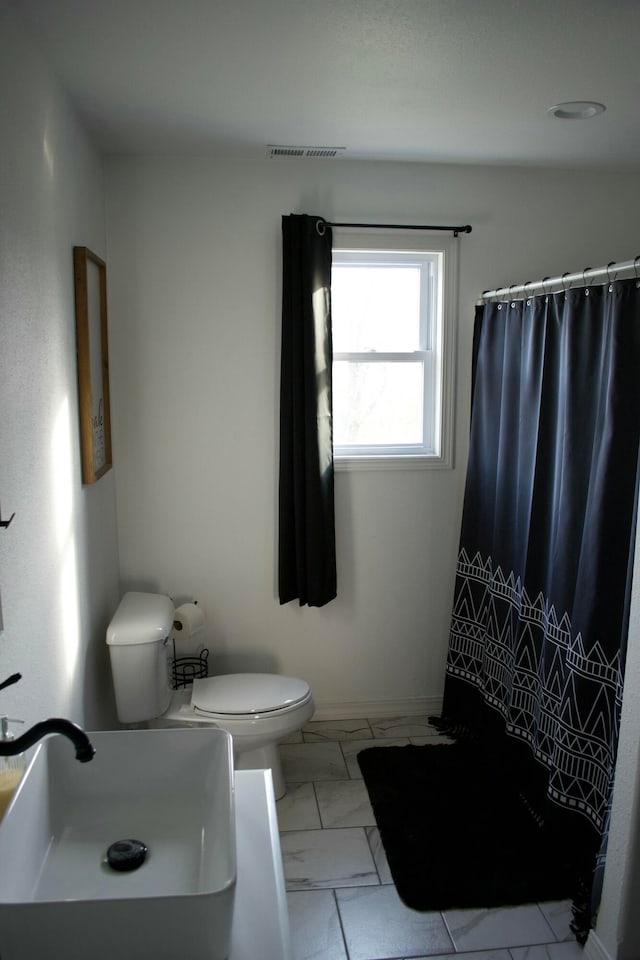 bathroom with toilet and sink