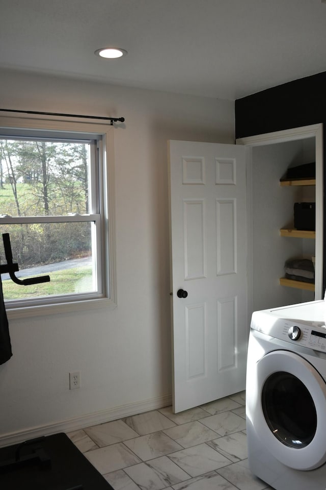 laundry room with washer / dryer