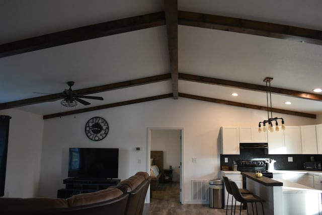 living room with vaulted ceiling with beams, dark hardwood / wood-style floors, and ceiling fan with notable chandelier