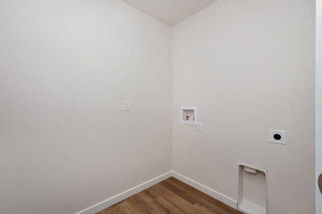 laundry area with washer hookup, dark wood-type flooring, and electric dryer hookup