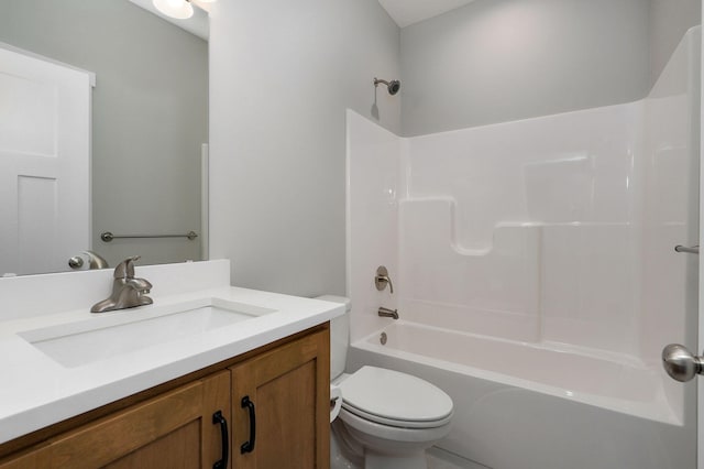 full bathroom featuring washtub / shower combination, vanity, and toilet