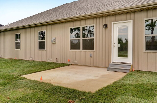 rear view of property with a patio area and a yard