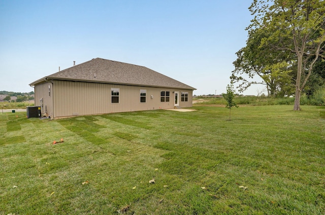 view of property exterior featuring a yard and central air condition unit