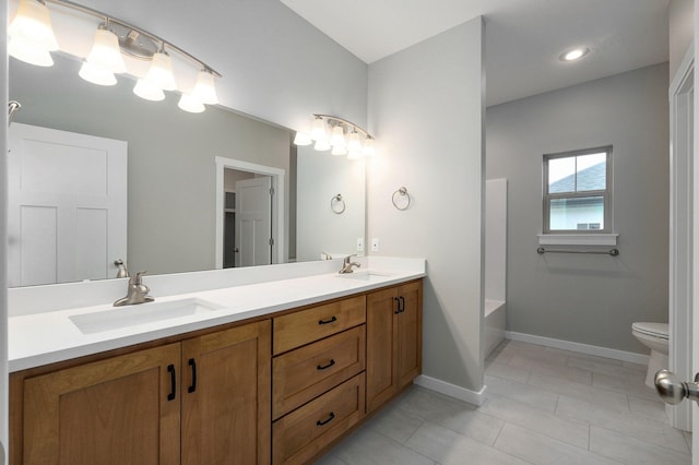 bathroom with vanity and toilet