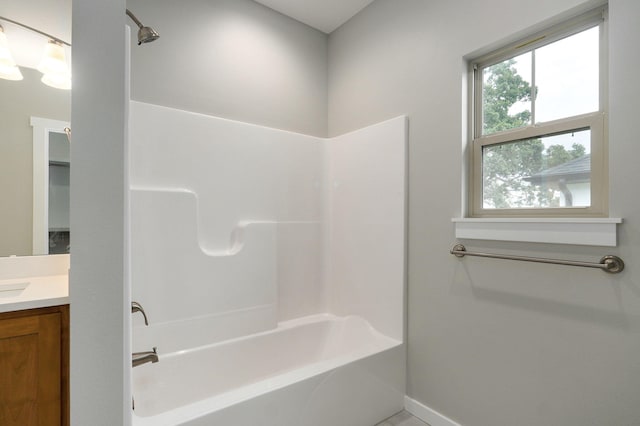 bathroom with bathing tub / shower combination and vanity