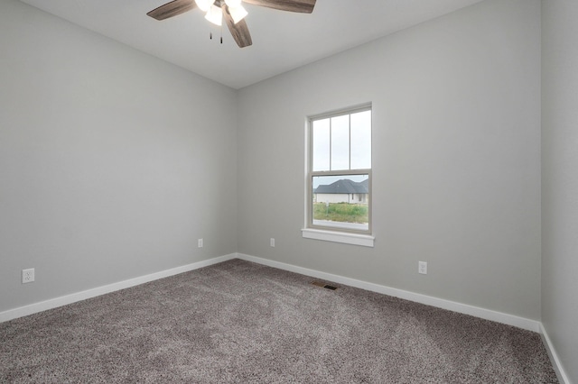 unfurnished room with carpet and ceiling fan