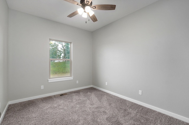 spare room featuring carpet flooring and ceiling fan