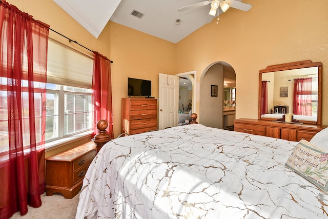 bedroom featuring ceiling fan, lofted ceiling, and light carpet