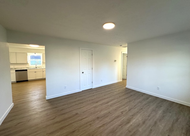 spare room featuring dark hardwood / wood-style floors and sink