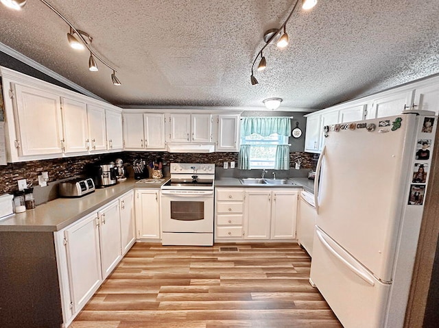 kitchen with white cabinetry, white appliances, ornamental molding, and sink