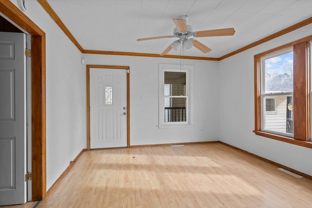 entrance foyer featuring light hardwood / wood-style flooring, ceiling fan, and crown molding