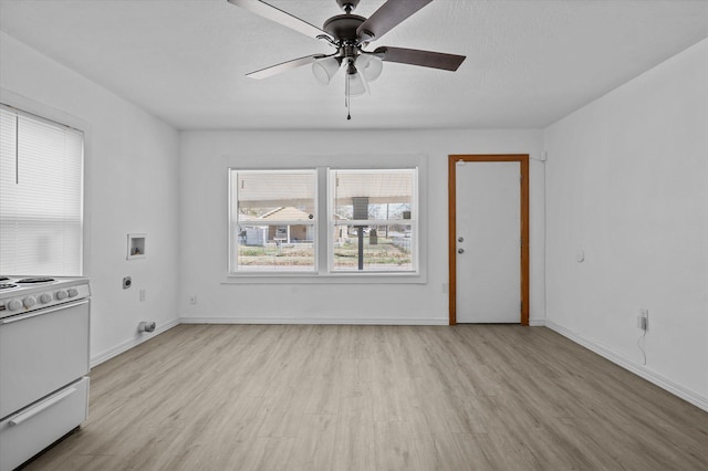 unfurnished living room featuring ceiling fan and light wood-type flooring