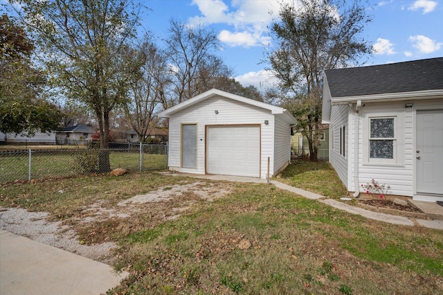 garage featuring a lawn