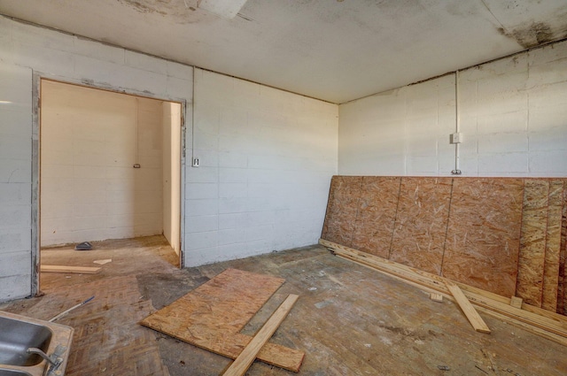 418 S Elm St, Mountain Grove, MO 65711 - empty room featuring concrete block wall