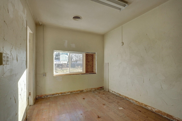 empty room with light wood-type flooring