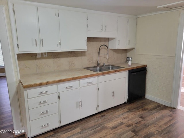 kitchen featuring black dishwasher, sink, white cabinets, and dark wood-type flooring