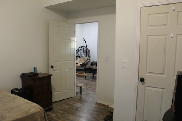 bedroom featuring dark wood-type flooring