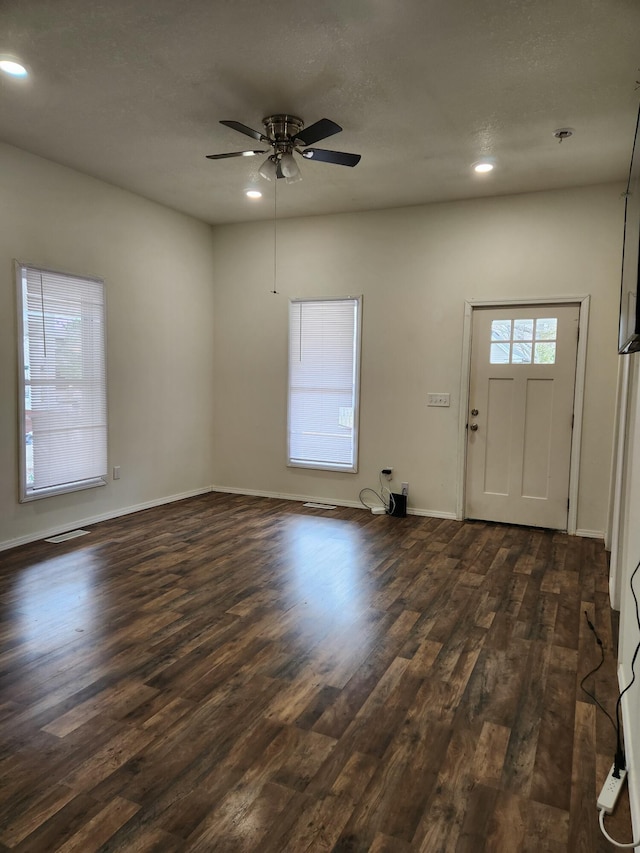 entrance foyer featuring recessed lighting, dark wood-style floors, and baseboards