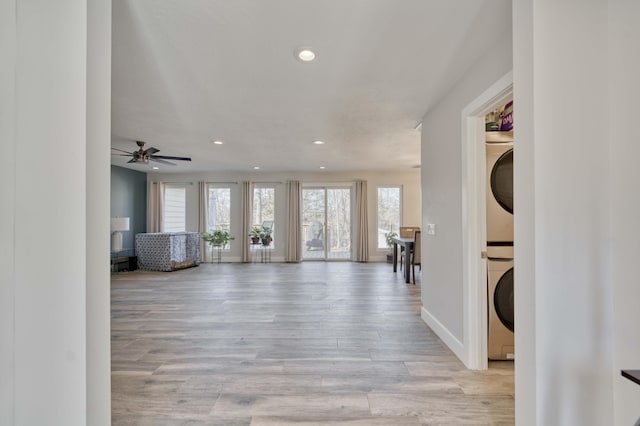 interior space featuring light hardwood / wood-style flooring and stacked washing maching and dryer