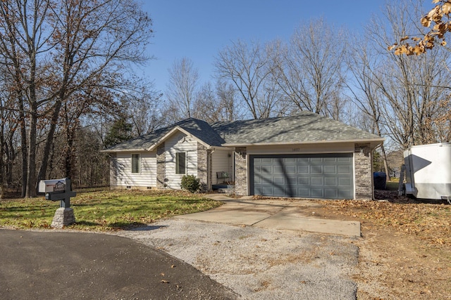 ranch-style home featuring a garage and a front lawn