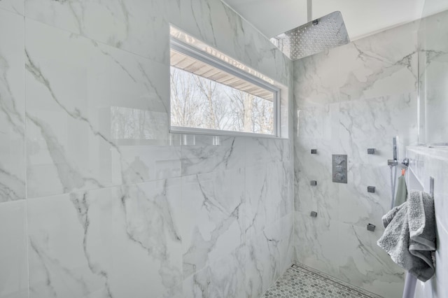 bathroom with tiled shower