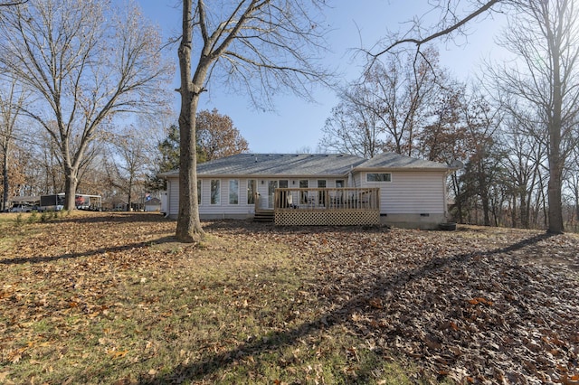 back of house with a wooden deck