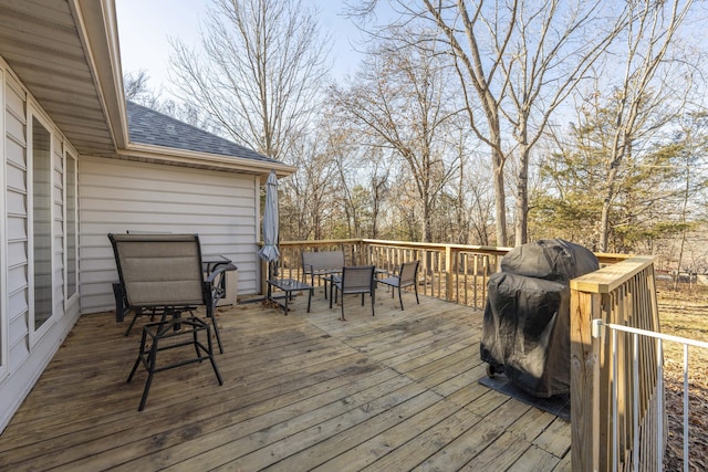 wooden terrace with a grill