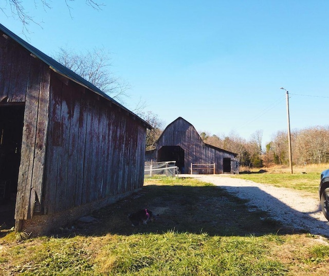 view of side of property with an outbuilding