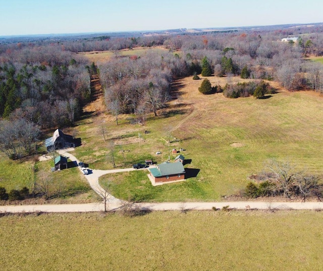 birds eye view of property with a rural view