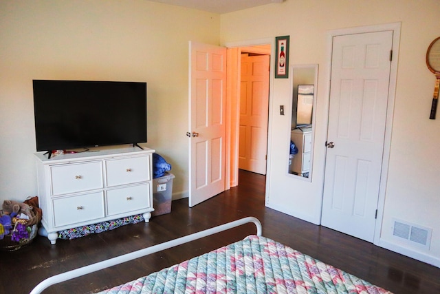 bedroom featuring dark wood-type flooring