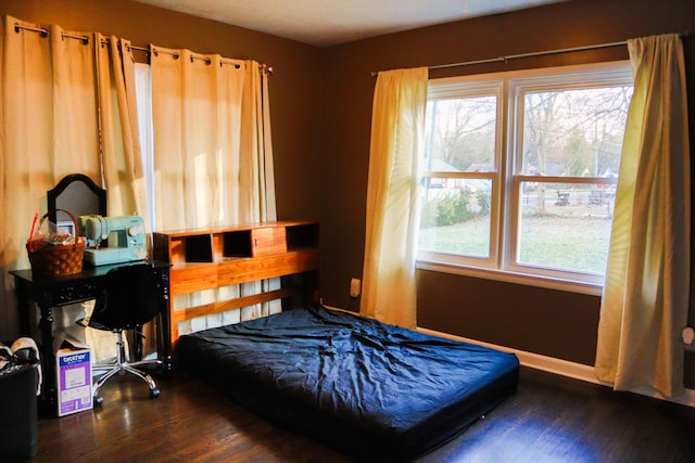 bedroom featuring dark wood-type flooring