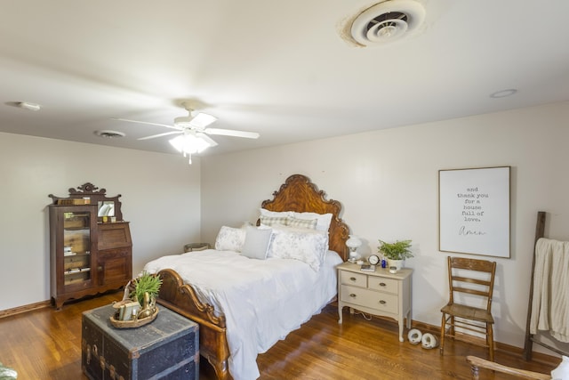 bedroom with ceiling fan and dark hardwood / wood-style floors