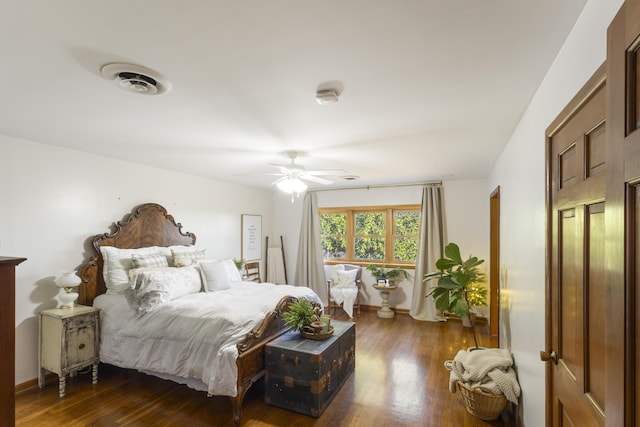 bedroom featuring dark hardwood / wood-style flooring and ceiling fan