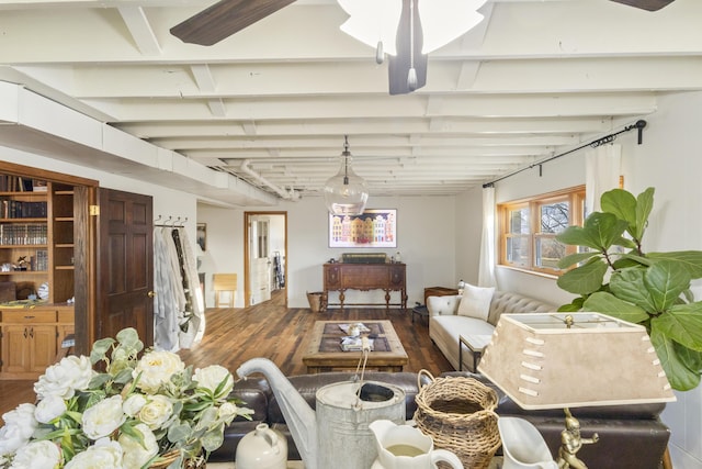 living room with beamed ceiling and wood-type flooring