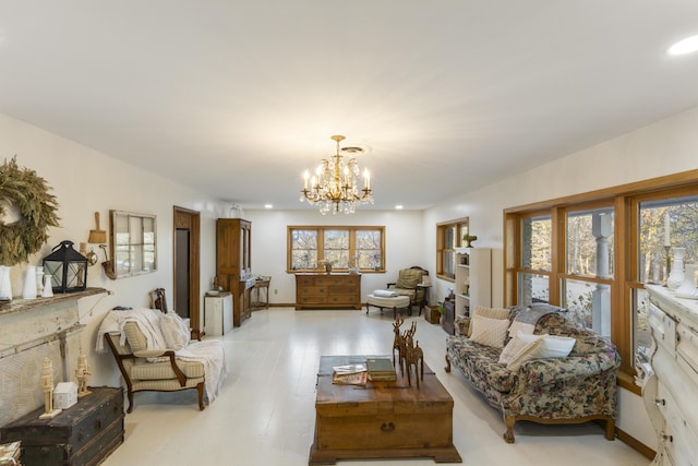 living room with light hardwood / wood-style floors and a notable chandelier