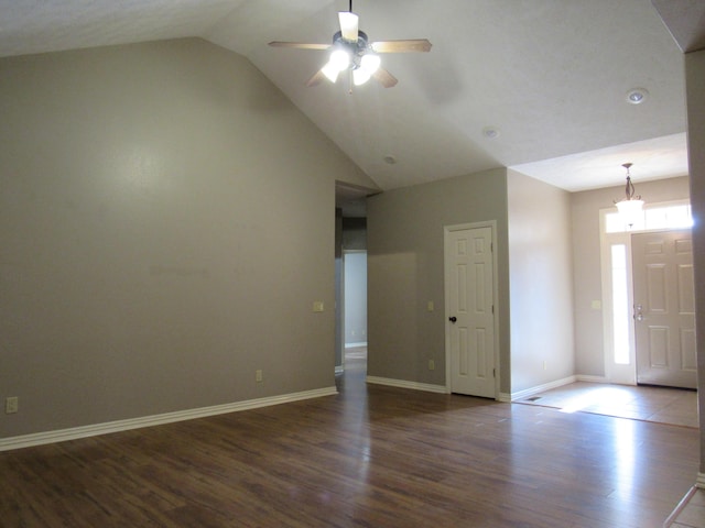 interior space featuring dark hardwood / wood-style floors, a wealth of natural light, lofted ceiling, and ceiling fan